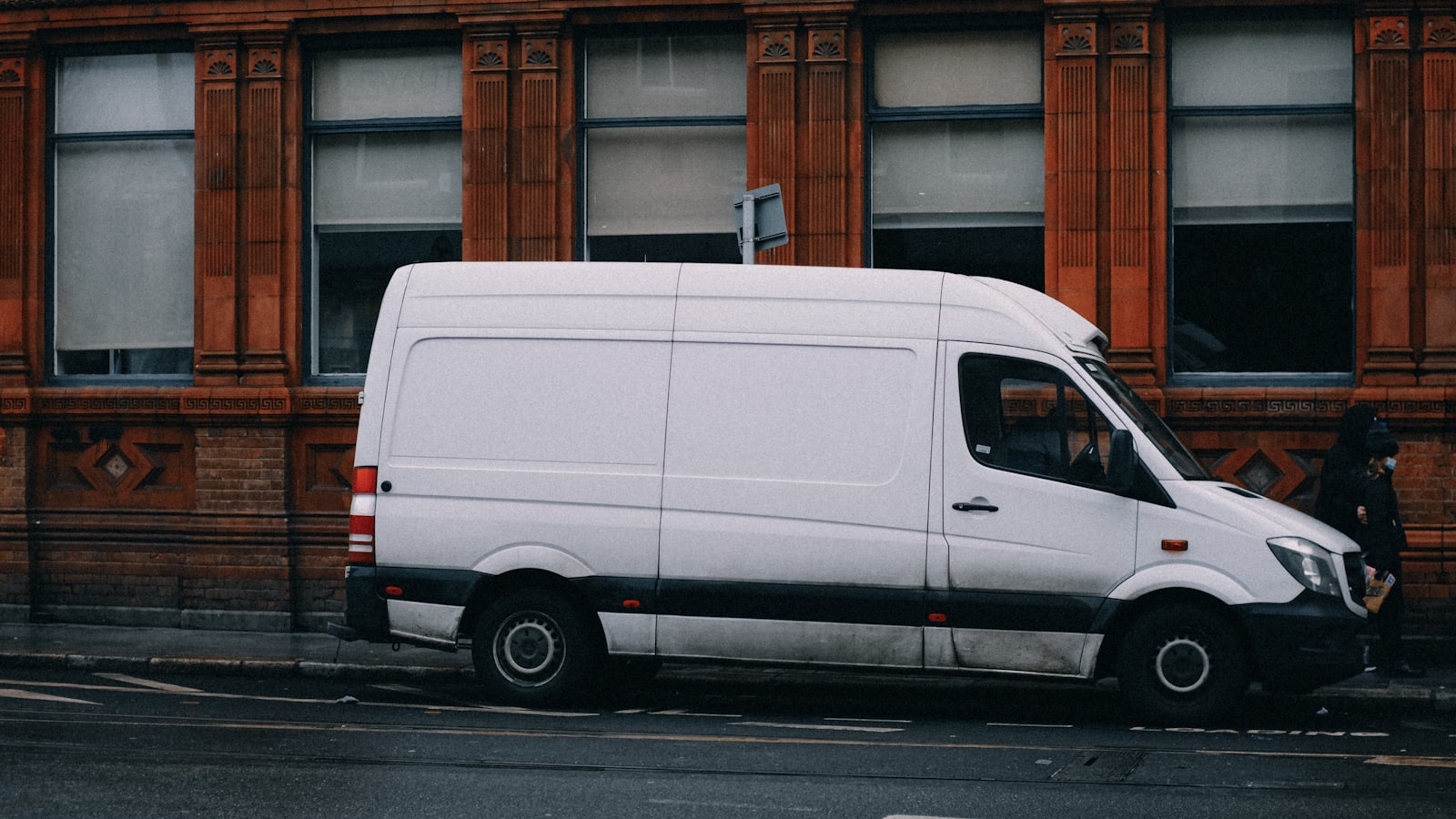 A Benchmark Air service van parked on the job.